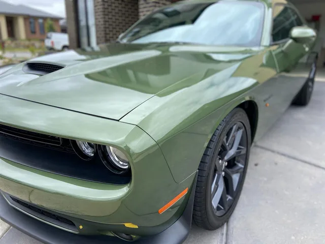 Dodge Challenger in green after paint restoration
