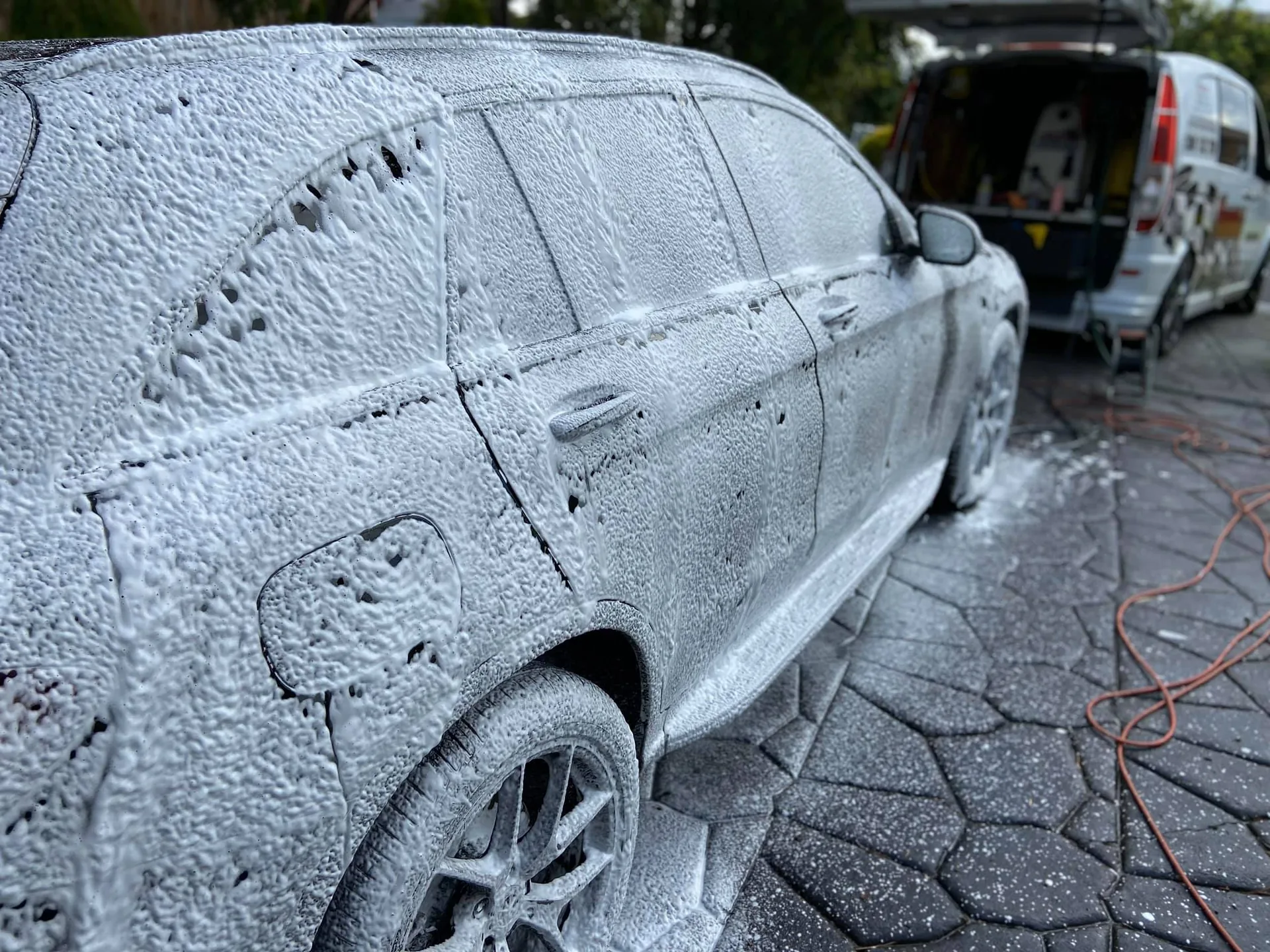 Vehicle under foam during the decontamination wash