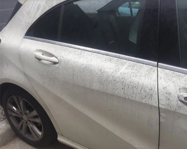 White Mercedes A-Class with heavy fallout on the rear quarter