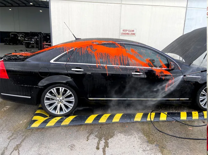 Multiple vehicles affected by paint overspray at a work site